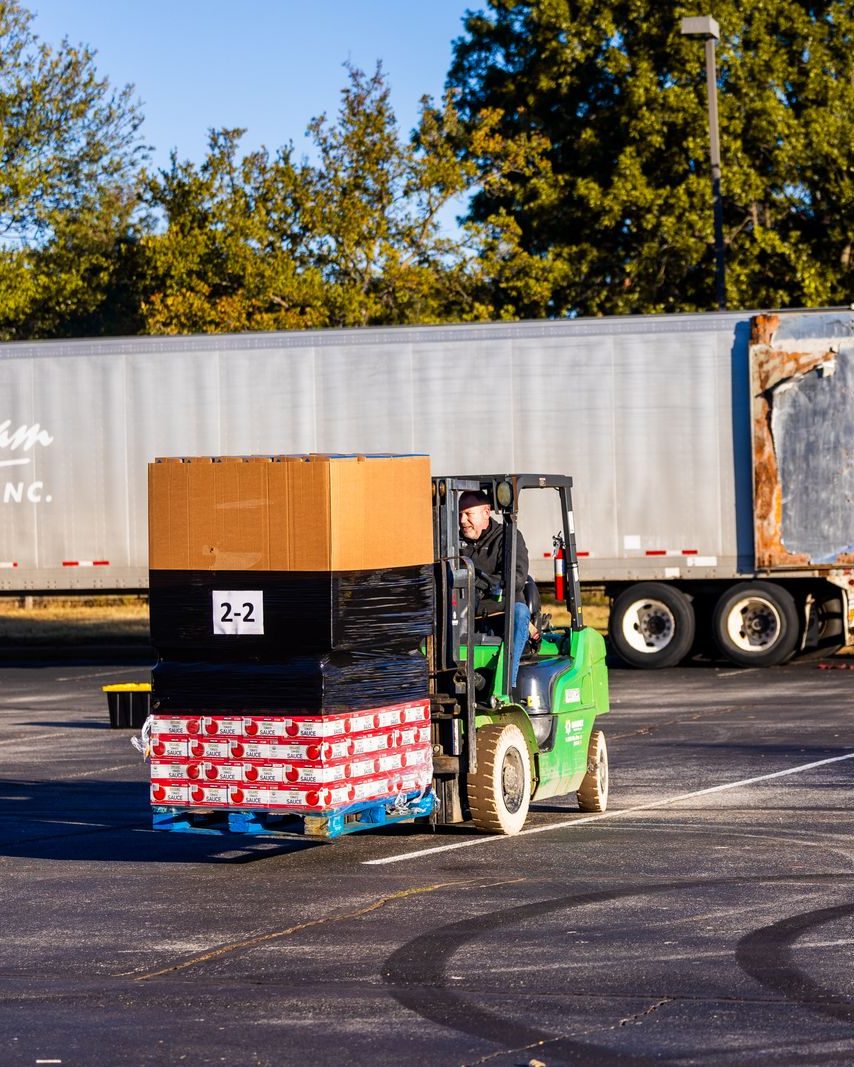 Forklift loading pallets into a dry-van trailer